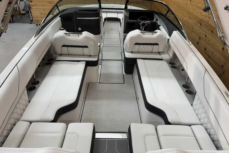 Slide: The Image of Luxurious interior of 2025 Regal LS6 boat with spacious white seating and modern design. - 7