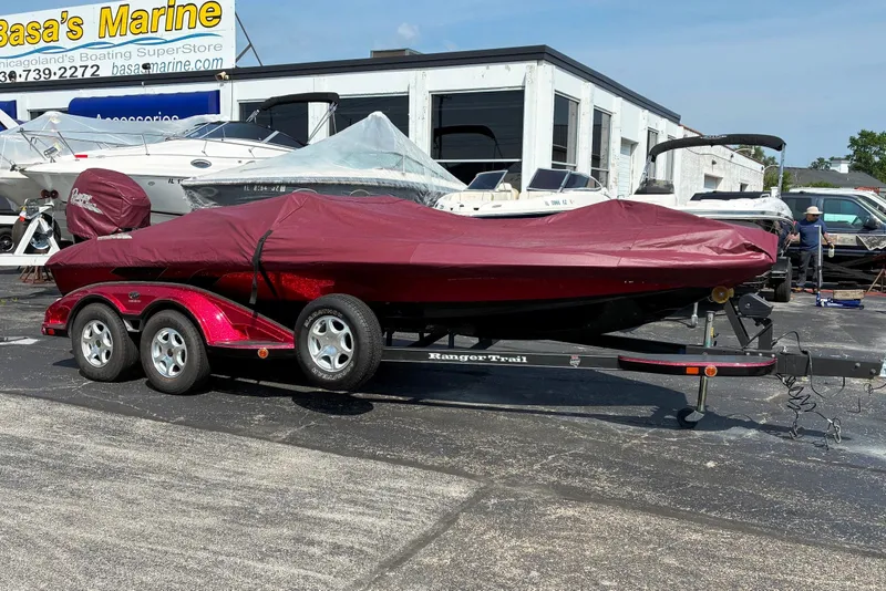 Slide: The Image of 2006 Ranger Z20 Comanche boat covered on trailer at Basa's Marine dealership. - 3
