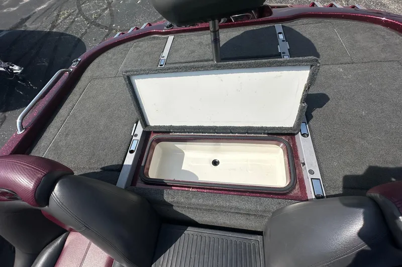 Slide: The Image of 2006 Ranger Z20 Comanche boat interior with open storage compartment. - 13