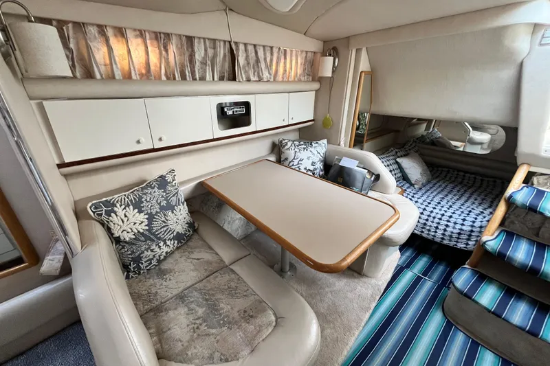 Slide: The Image of Interior of 1995 Sea Ray Sundancer 330 with cozy seating and dining area. - 15