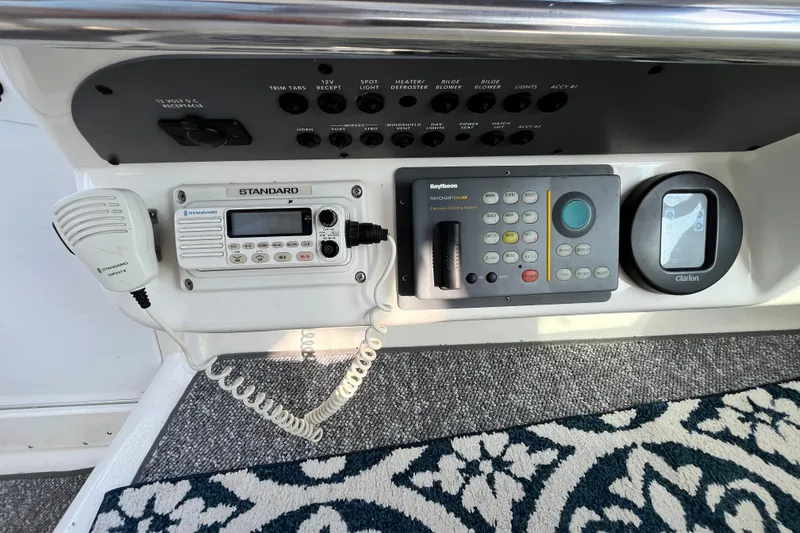 Slide: The Image of Control panel of a 1995 Sea Ray Sundancer 330 with radio and navigation systems. - 10