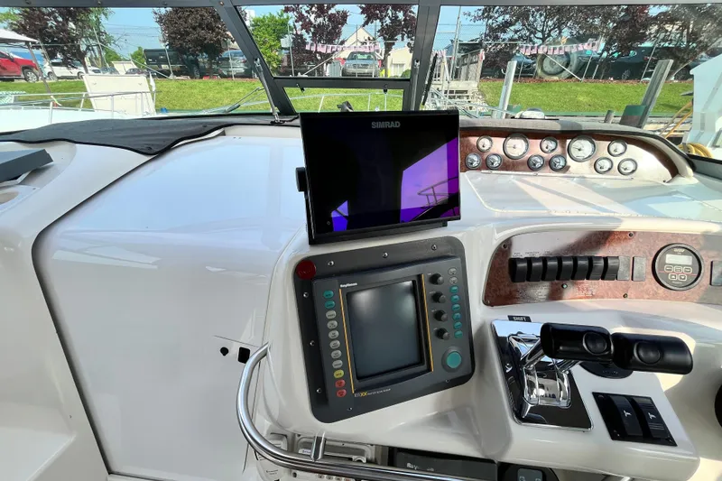 Slide: The Image of Control panel of a 1995 Sea Ray Sundancer 330 boat with navigation equipment. - 7
