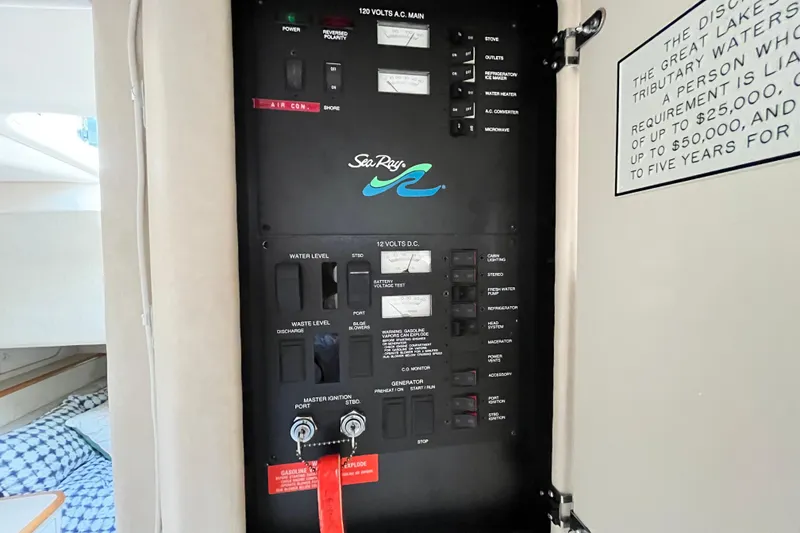Slide: The Image of Electrical panel inside a 1995 Sea Ray Sundancer 330 boat cabin. - 21