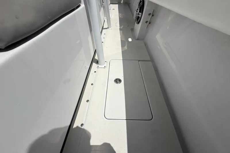 Slide: The Image of Interior view of a 1995 Intrepid 323 Open boat, showcasing sleek deck design. - 54