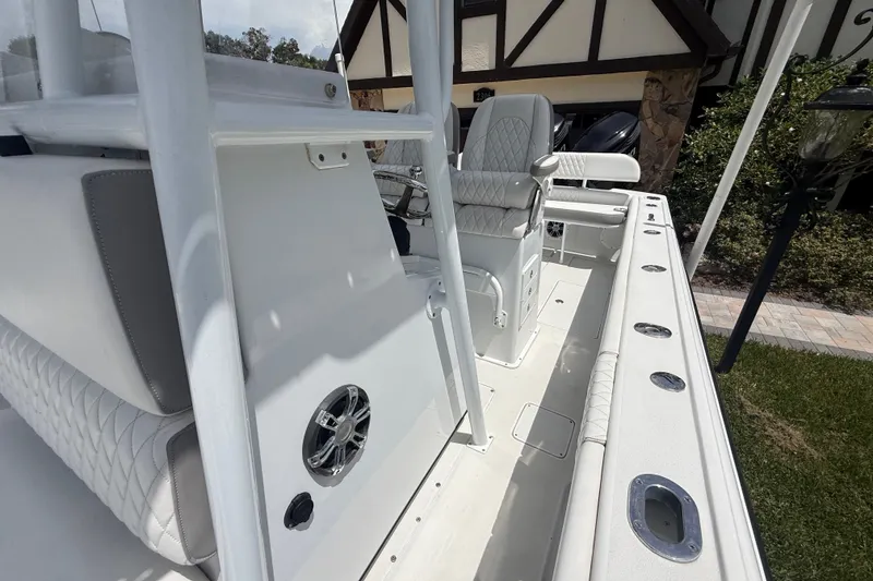 Slide: The Image of 1995 Intrepid 323 Open boat interior with white seating and modern features. - 58