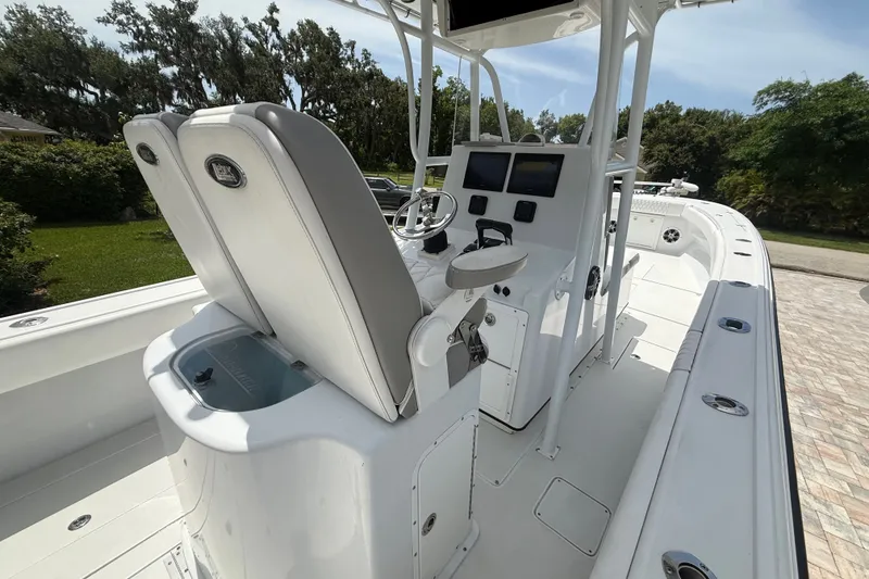 Slide: The Image of 1995 Intrepid 323 Open boat interior with helm, seating, and navigation equipment. - 15