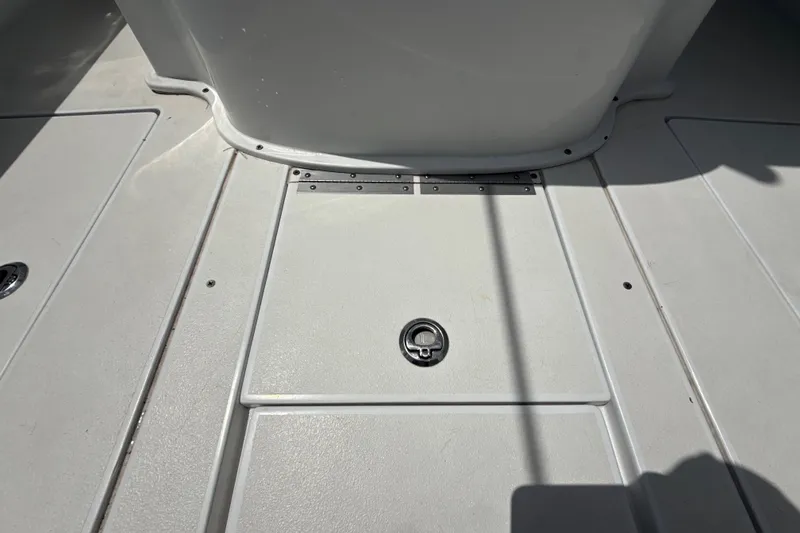 Slide: The Image of Deck of a 1995 Intrepid 323 Open boat, featuring a hatch and clean surface. - 70