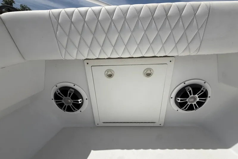 Slide: The Image of Interior of 1995 Intrepid 323 Open boat with speakers and quilted upholstery. - 40