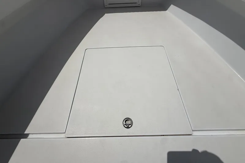 Slide: The Image of Deck hatch of a 1995 Intrepid 323 Open boat, featuring a sleek, clean design. - 38