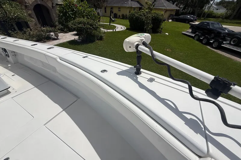 Slide: The Image of 1995 Intrepid 323 Open boat deck with mounted equipment, parked in a residential area. - 46