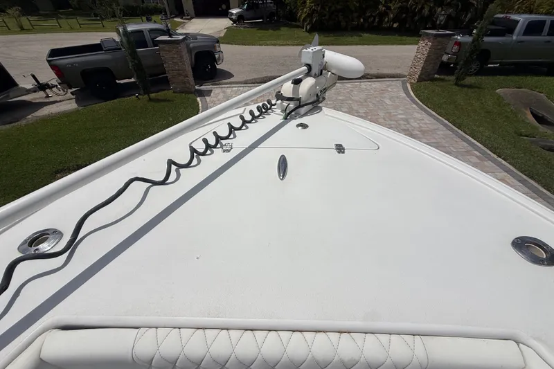 Slide: The Image of Bow view of 1995 Intrepid 323 Open boat with trolling motor and coiled cable. - 43