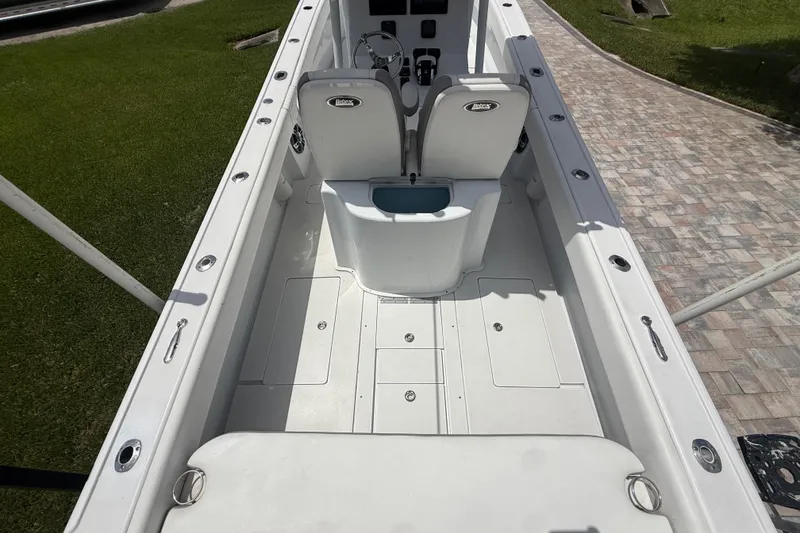 Slide: The Image of Interior view of a 1995 Intrepid 323 Open boat, showcasing seating and deck layout. - 10