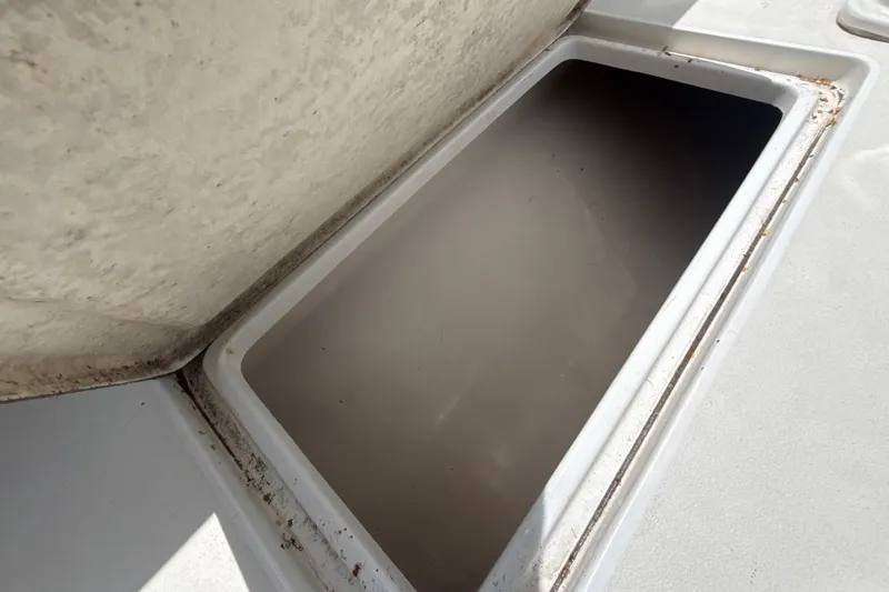 Slide: The Image of Open storage compartment on a 1995 Intrepid 323 Open boat deck. - 68