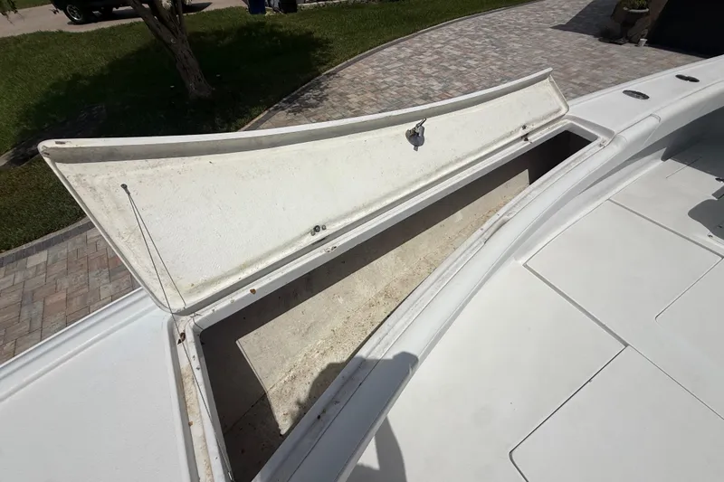 Slide: The Image of Open storage compartment on a 1995 Intrepid 323 Open boat, showing spacious interior. - 45