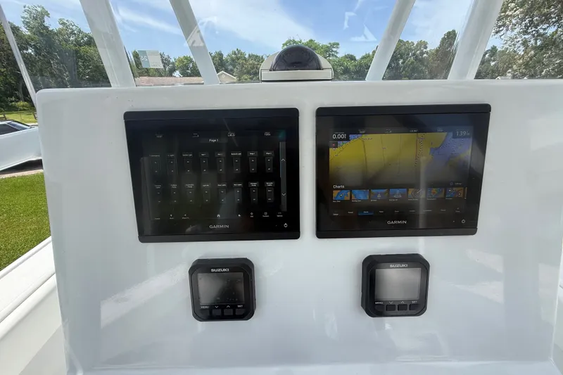 Slide: The Image of Garmin navigation screens on a 1995 Intrepid 323 Open boat dashboard. - 22