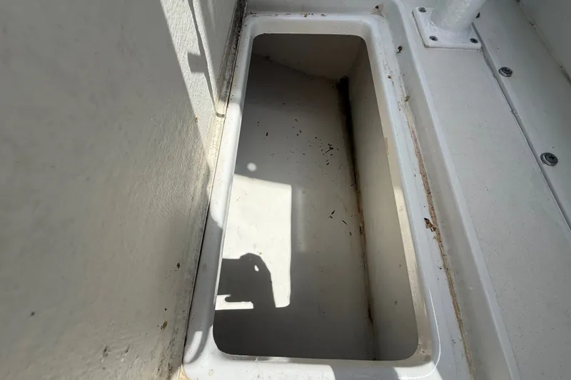 Slide: The Image of Storage compartment on a 1995 Intrepid 323 Open boat, showing interior details. - 53