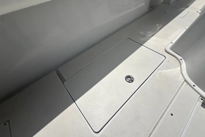 Slide: The Image of Deck of 1995 Intrepid 323 Open boat with storage compartment. - 67