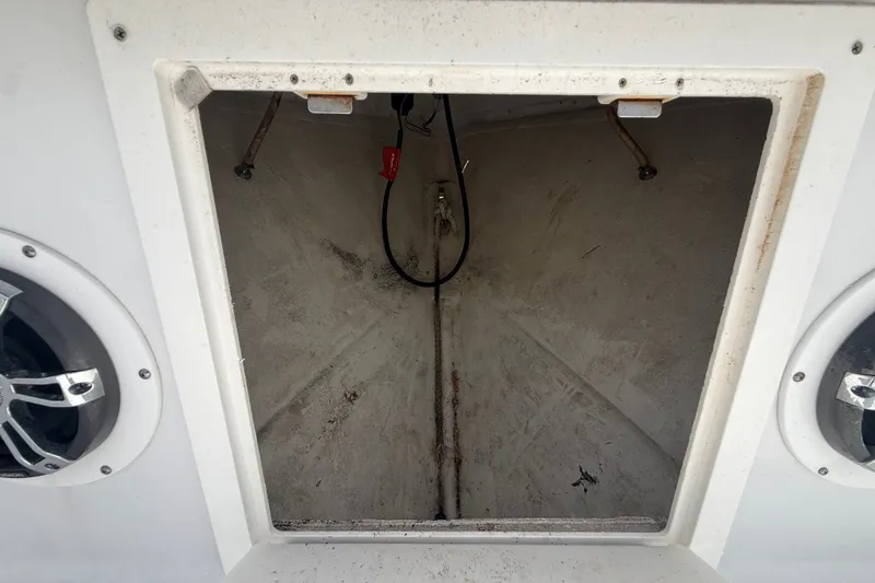 Slide: The Image of Open storage compartment on a 1995 Intrepid 323 Open boat, showing interior details. - 41