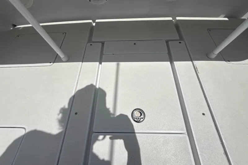 Slide: The Image of 1995 Intrepid 323 Open boat deck with shadow and hatch details. - 65