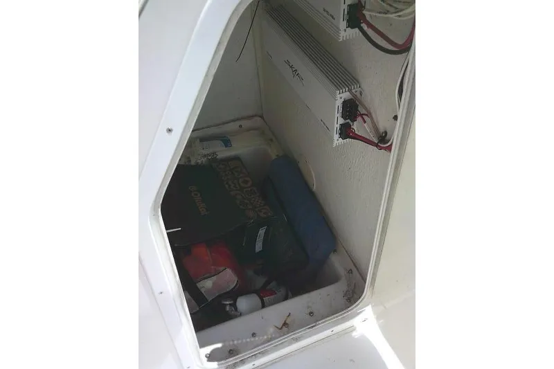 Slide: The Image of Storage compartment of a 2006 SeaChaser 250 BAYRUNNER boat with equipment and wiring. - 20