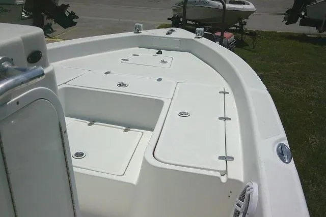 Slide: The Image of 2006 SeaChaser 250 BAYRUNNER boat deck with storage compartments and seating area. - 9