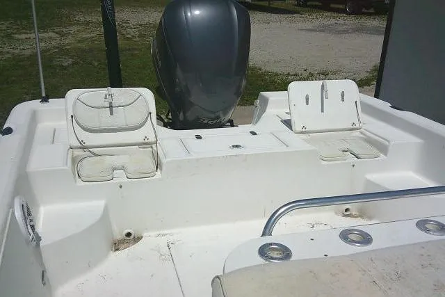 Slide: The Image of 2006 SeaChaser 250 BAYRUNNER boat interior with seating and motor view. - 21