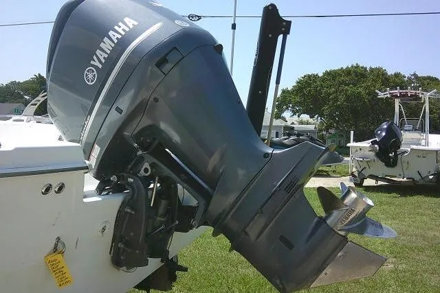 Slide: The Image of 2006 SeaChaser 250 BAYRUNNER with Yamaha outboard motor on grassy area. - 6