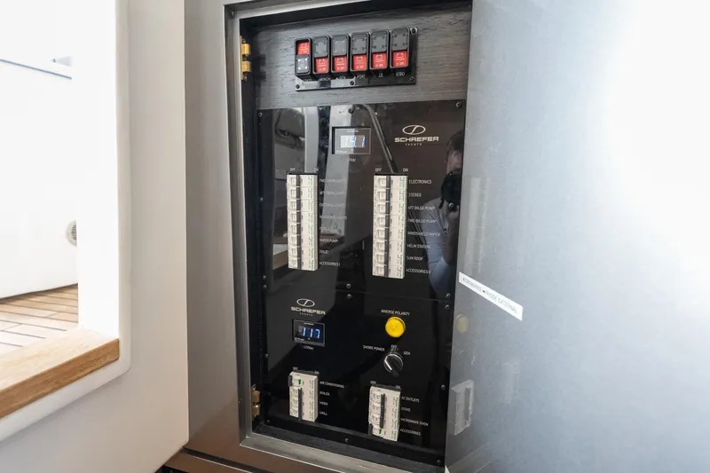 Slide: The Image of Electrical panel of 2024 Schaefer 375 yacht, featuring switches and circuit breakers. - 40