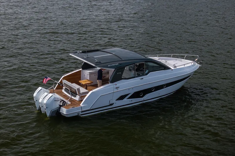 Slide: The Image of 2024 Schaefer 375 yacht cruising on open water, showcasing sleek design and powerful engines. - 5