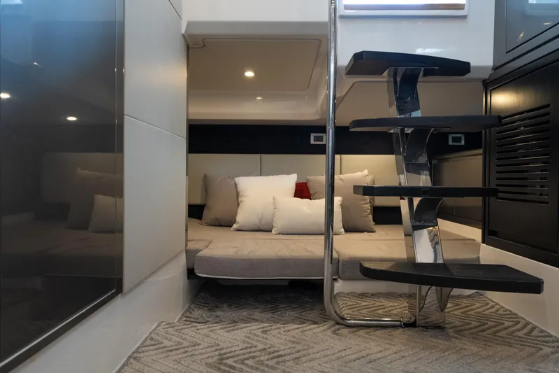 Slide: The Image of Interior of 2024 Schaefer 375 yacht with modern staircase and cozy bedding area. - 35