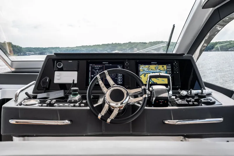 Slide: The Image of Helm of 2024 Schaefer 375 yacht with advanced navigation controls and displays. - 15