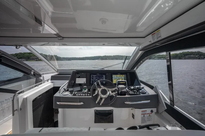 Slide: The Image of Interior view of 2024 Schaefer 375 yacht cockpit with advanced navigation system. - 13