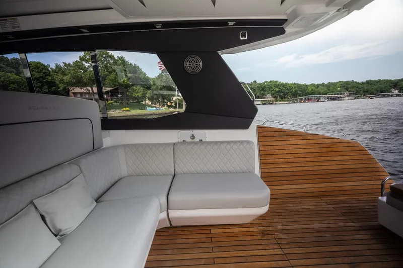 Slide: The Image of Luxurious interior of 2024 Schaefer 375 yacht with elegant seating and wooden deck. - 23