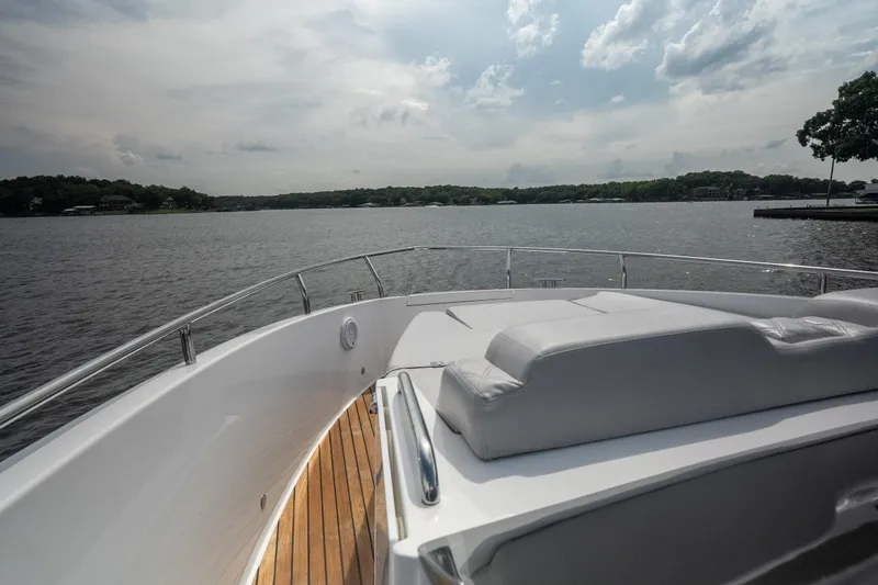 Slide: The Image of Luxurious 2024 Schaefer 375 yacht with sun deck, cruising on a serene lake. - 42