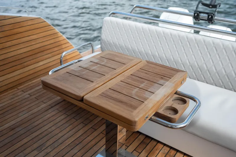 Slide: The Image of Luxury Schaefer 375 yacht deck with elegant wooden table, 2024 model. - 24