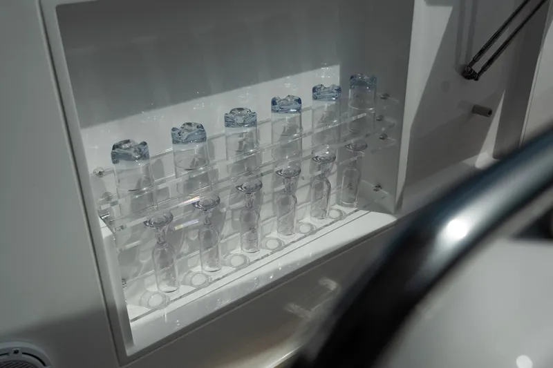 Slide: The Image of Glass storage rack on Schaefer 375 yacht, 2024 model, with neatly arranged bottles. - 41