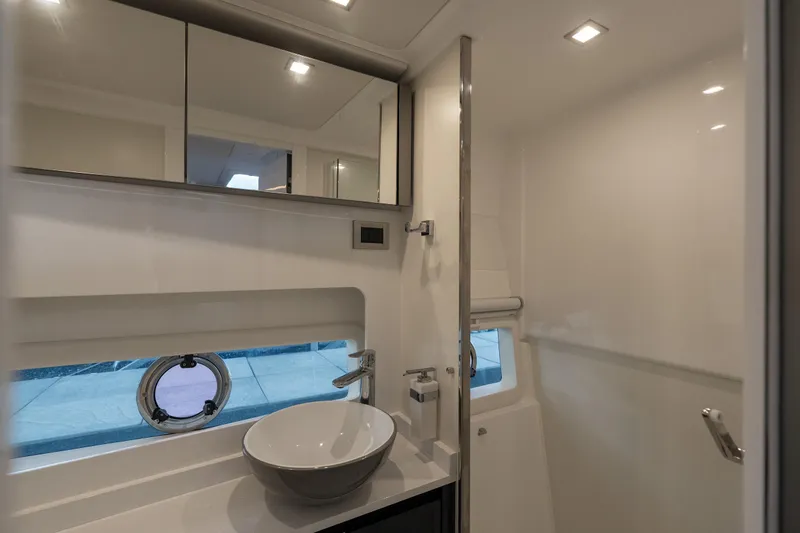 Slide: The Image of Luxurious bathroom in 2024 Schaefer 375 yacht with modern fixtures and porthole window. - 37