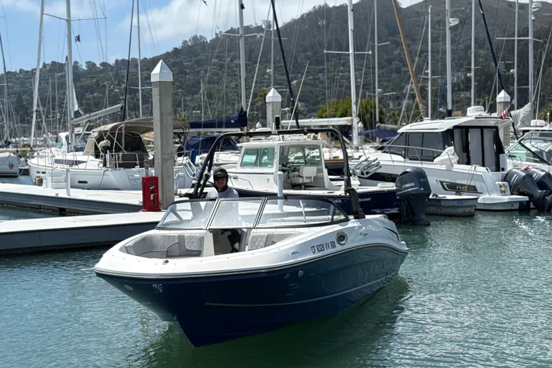 Slide: The Image of 2021 Bayliner VR5 Bowrider I/O in marina, surrounded by sailboats and yachts. - 13
