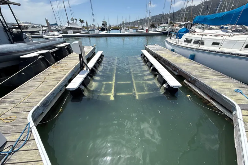 Slide: The Image of Marina with docks and boats, featuring a 2021 Bayliner VR5 Bowrider I/O. - 19