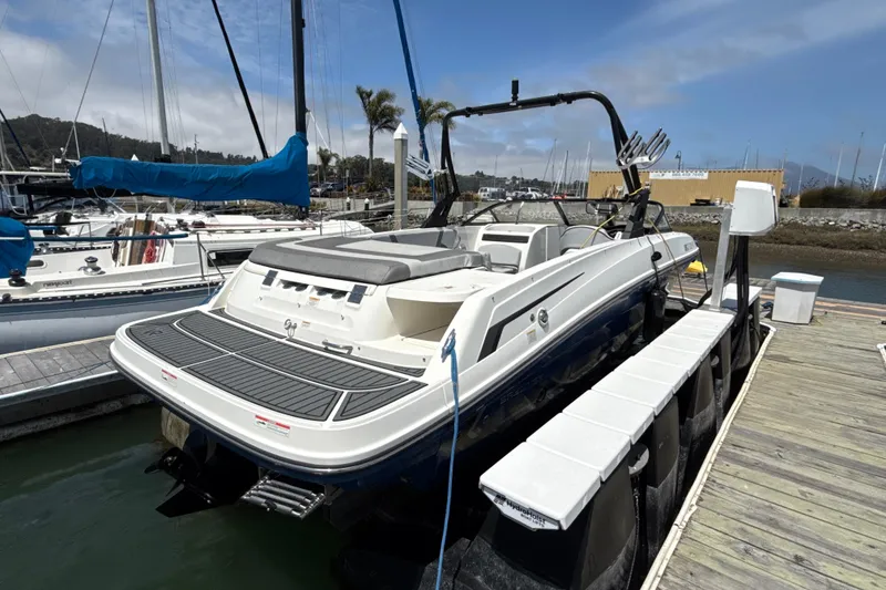 Slide: The Image of 2021 Bayliner VR5 Bowrider I/O docked at marina, rear view. - 22
