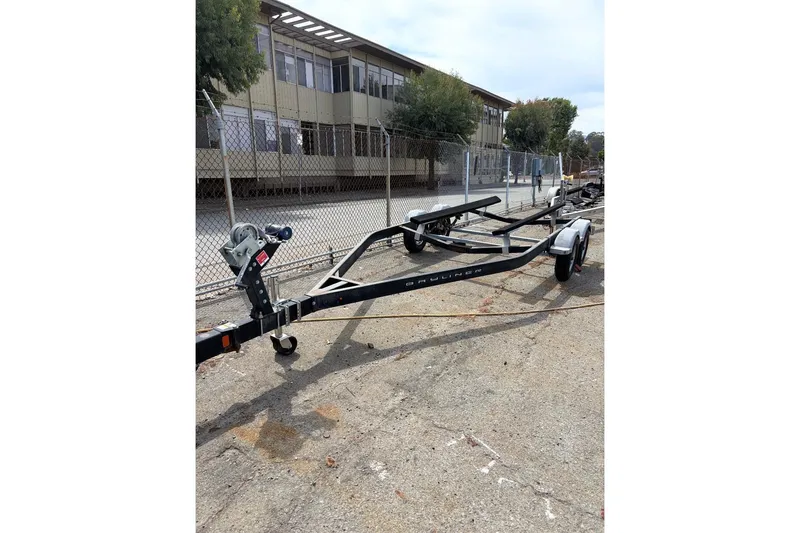 Slide: The Image of Trailer for 2021 Bayliner VR6 Bowrider I/O parked outdoors. - 19