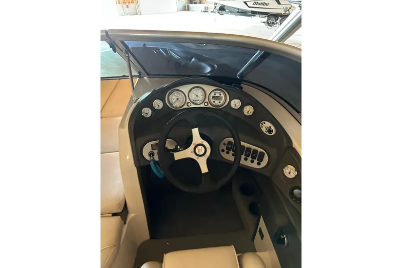 Slide: The Image of 2004 Moomba Mobius XLV boat dashboard with steering wheel and instrument panel. - 4