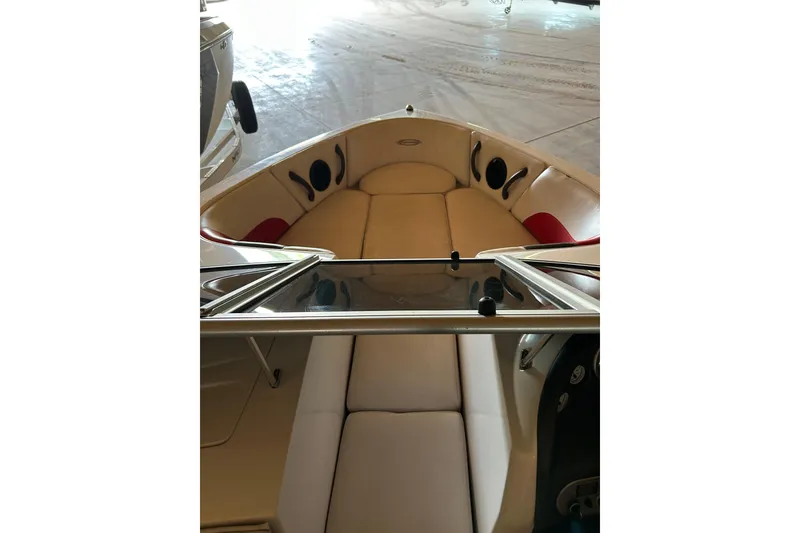 Slide: The Image of 2004 Moomba Mobius XLV boat interior with beige seating and speaker system. - 3