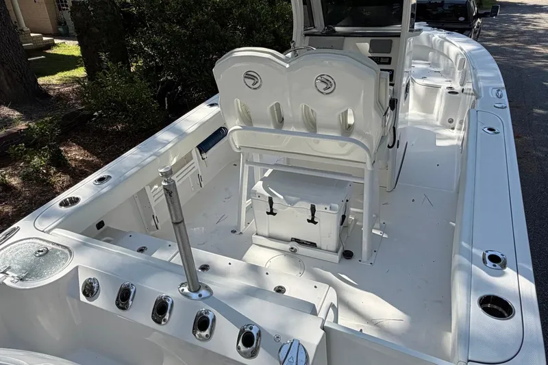 Slide: The Image of 2019 Edgewater 230CC boat interior with seating and storage compartments. - 28