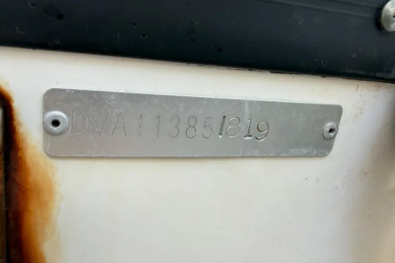 Slide: The Image of Metal identification plate on 2019 Edgewater 230CC boat, displaying serial number. - 29