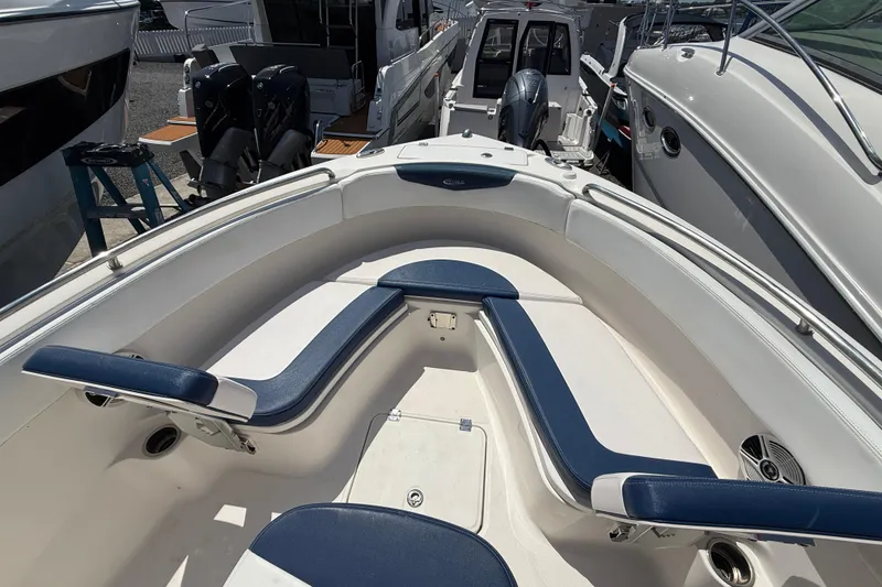 Slide: The Image of 2018 Robalo R222 Explorer boat interior with blue and white seating. - 14