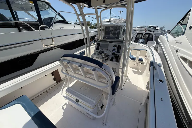 Slide: The Image of 2018 Robalo R222 Explorer boat interior with helm, seating, and controls. - 8