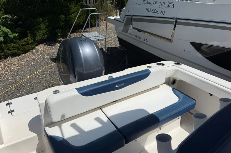 Slide: The Image of 2018 Robalo R222 Explorer boat interior with seating and Yamaha outboard motor. - 5