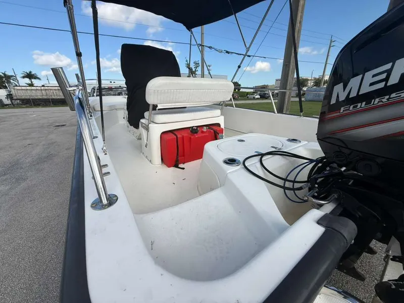 Slide: The Image of The image shows the cockpit of a 2016 Boston Whaler 170 Montauk with a Mercury engine. - 8