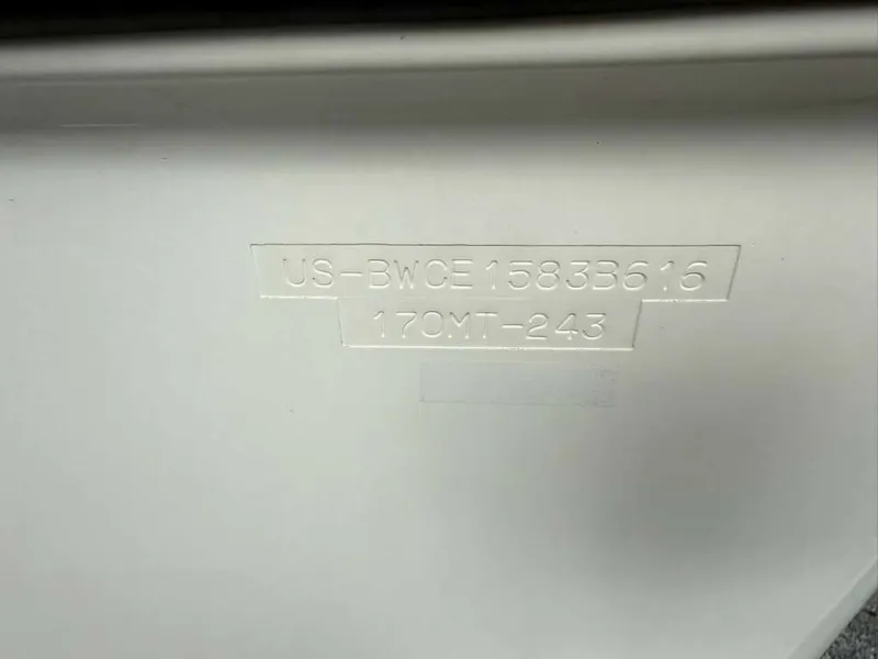 Slide: The Image of Close-up of the hull identification number on a white boat. - 21